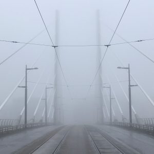 A foggy bridge that could be a gate